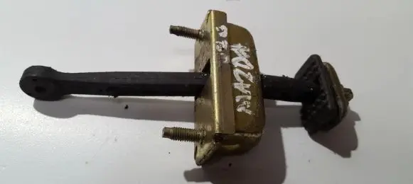 Mazda 626 Rear door check strap stopper 5173991J25A 58270