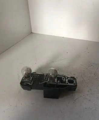 Tail light bulb cover holder