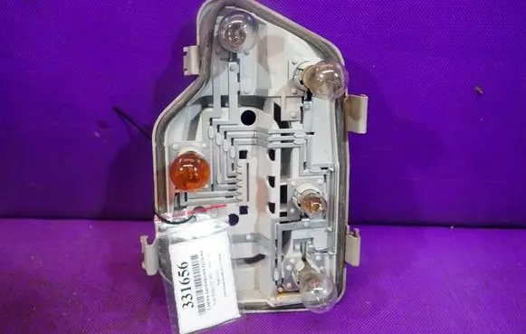 Tail light bulb cover holder