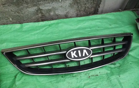 KIA Carens I Front grill OK2EF50710