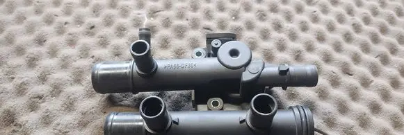 Thermostat/thermostat housing