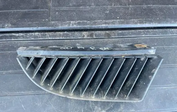 Mitsubishi Colt Front bumper upper radiator grill MN127774