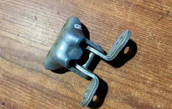 Front door lower hinge