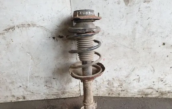 Subaru Impreza II Front shock absorber with coil spring
