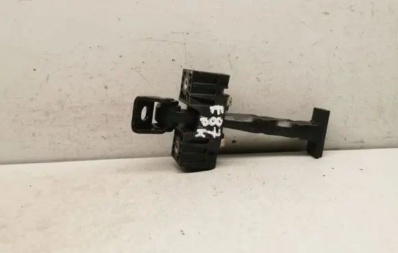 Front door check strap stopper