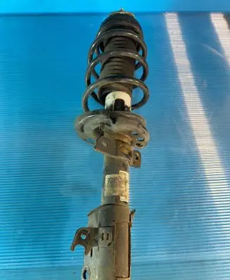 Ford Fiesta Front shock absorber with coil spring 61471149