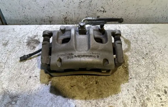 Jeep Grand Cherokee WL Front brake caliper 68338904AA