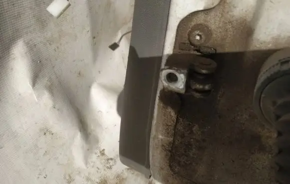 Front door check strap stopper