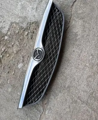 Mazda 626 Front bumper upper radiator grill GE4V50719