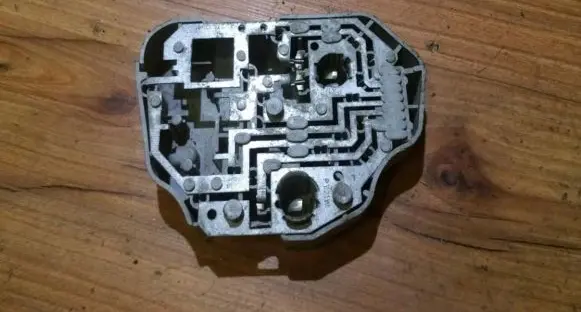 Tail light bulb cover holder
