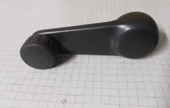 Nissan Primera Rear door window winding handle 