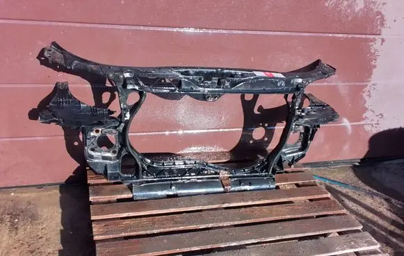 Radiator support slam panel
