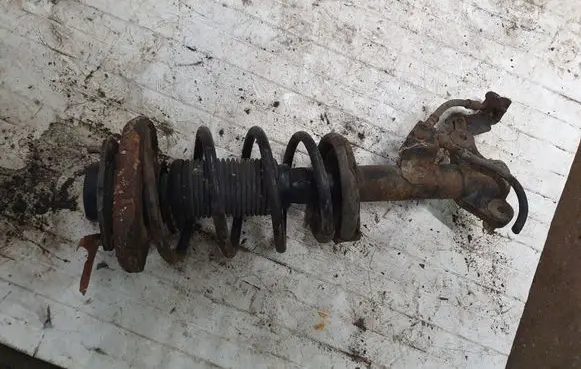 Nissan Primera Front shock absorber with coil spring NOCODE