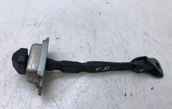 Front door check strap stopper