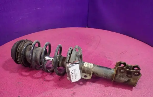 Front shock absorber with coil spring