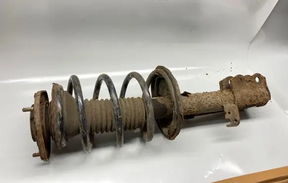 Front shock absorber with coil spring