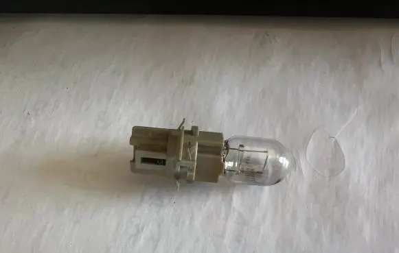 Mazda 6 Tail light bulb cover holder