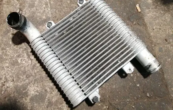 KIA Carens I Intercooler radiator 2827127350