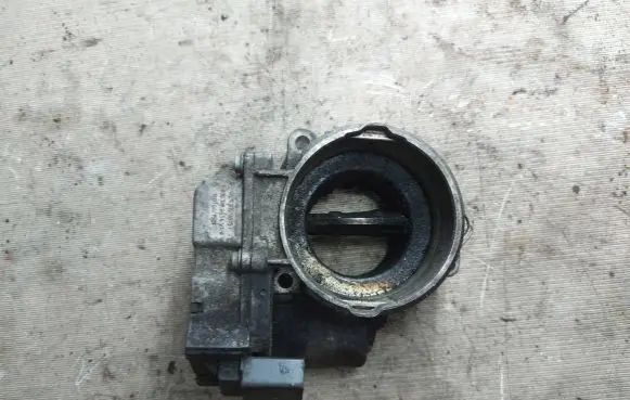 Volkswagen Touran I Throttle valve 03G128063C 1801061501 A2C53099815