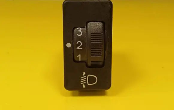 Headlight level height control switch
