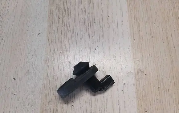 Front door check strap stopper