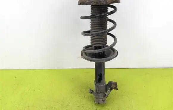 Nissan Almera Tino Front shock absorber with coil spring