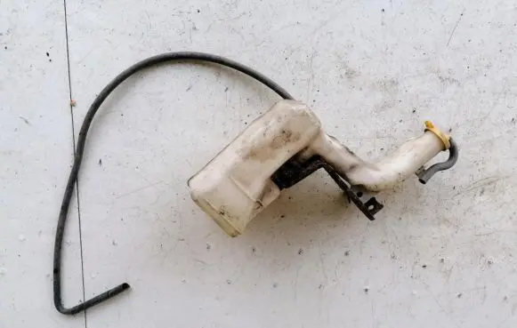 Mazda 323 Windshield washer fluid reservoir/tank