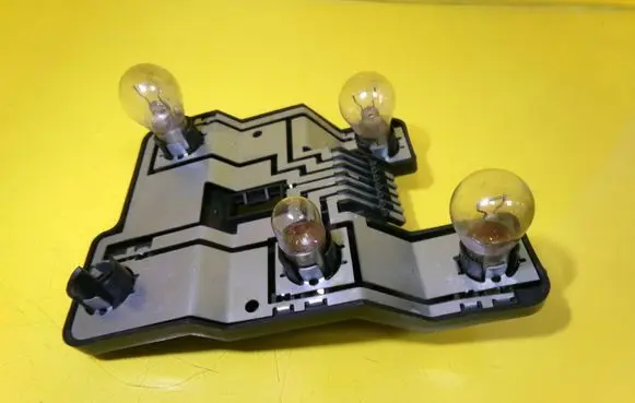 Tail light bulb cover holder