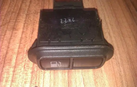 KIA Sedona Fuel tank opening switch 