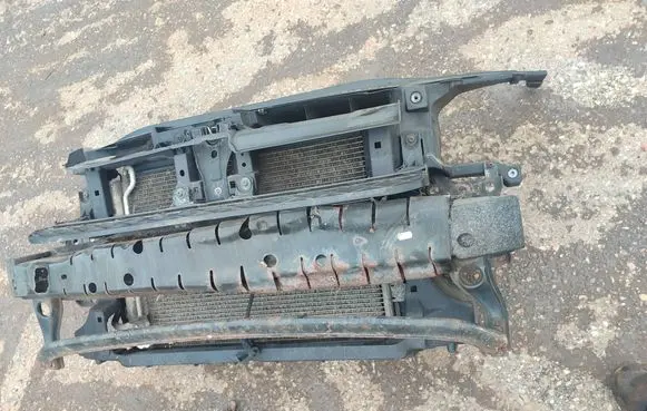Volkswagen PASSAT B7 Radiator support slam panel 3AA121253 1K0121207BC