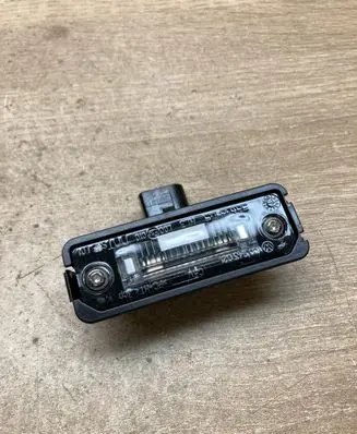 Volkswagen New Beetle Number plate light 1C0943021