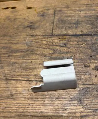 Front passenger seat rail trim