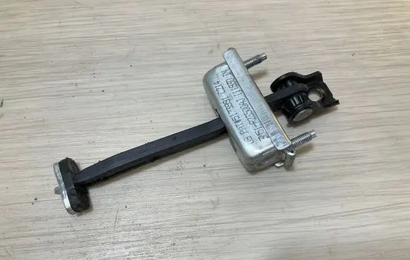Front door check strap stopper