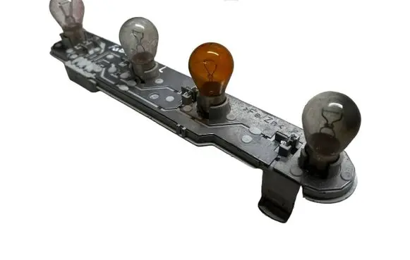 Tail light bulb cover holder