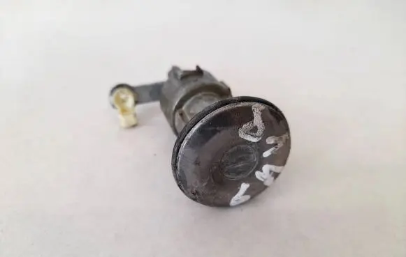 Mazda 626 Front door lock (next to the handle) 