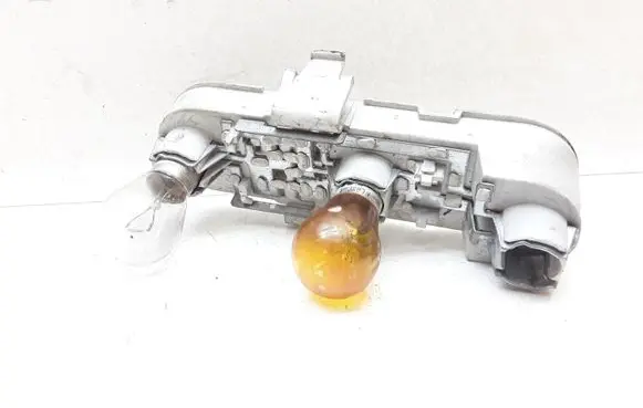 Tail light bulb cover holder