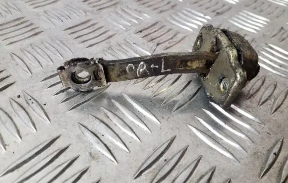 Front door check strap stopper