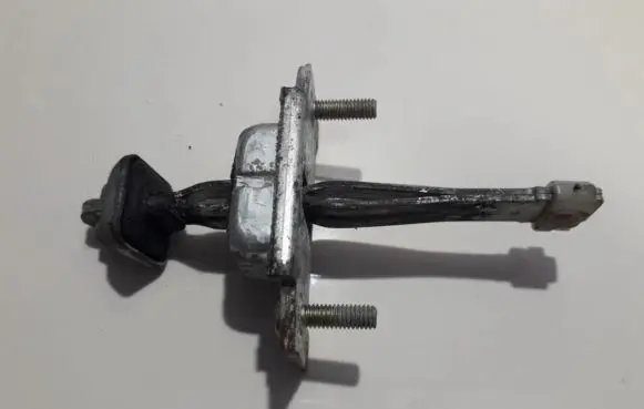 Mazda 323 Rear door check strap stopper