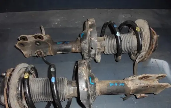 Subaru Impreza IV Front shock absorber with coil spring