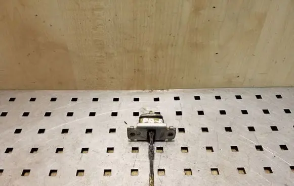 Front door check strap stopper