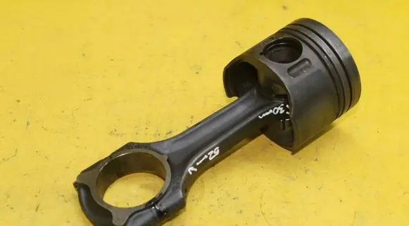 Piston with connecting rod