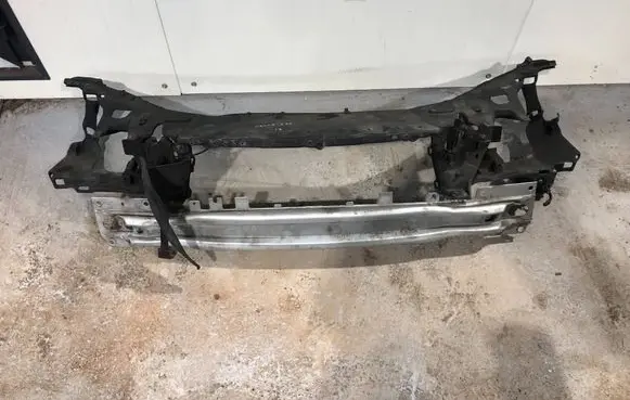 Radiator support slam panel