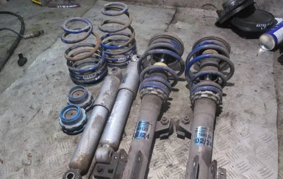 Opel Astra H Front shock absorber with coil spring 