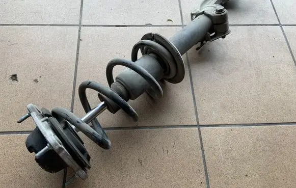 Front shock absorber with coil spring