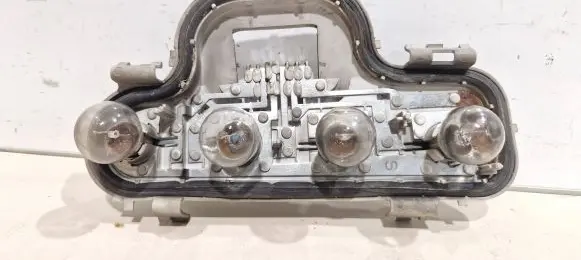 Tail light bulb cover holder