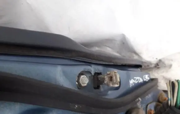 Mazda 626 Front door check strap stopper 