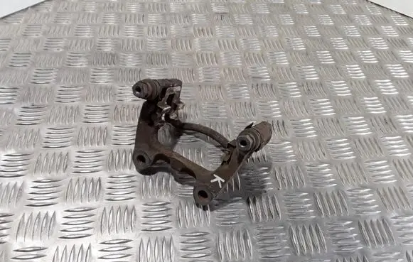 Volkswagen PASSAT B6 Brake caliper pad carrier rear 