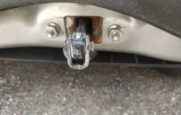 Front door check strap stopper