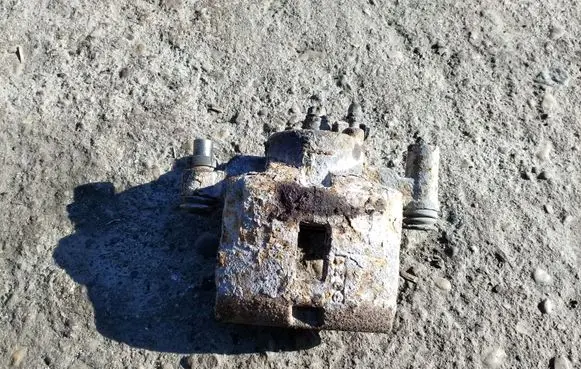 Mazda 323 Front brake caliper