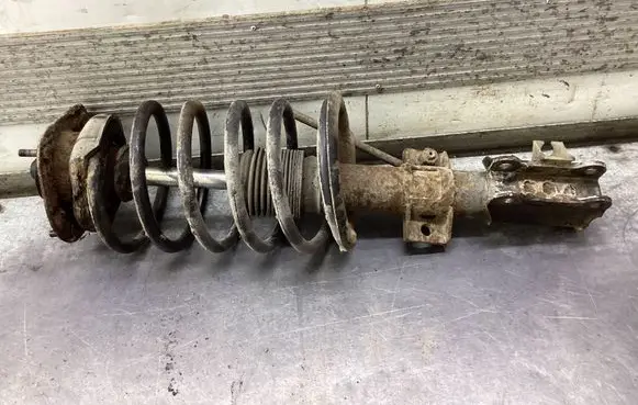 Front shock absorber with coil spring